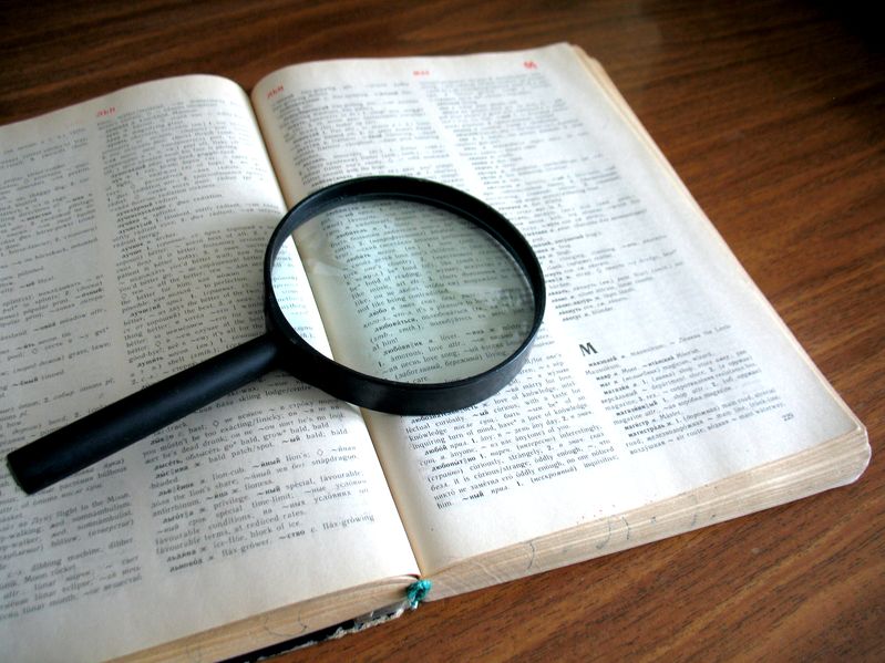 magnifying glass sitting on a book